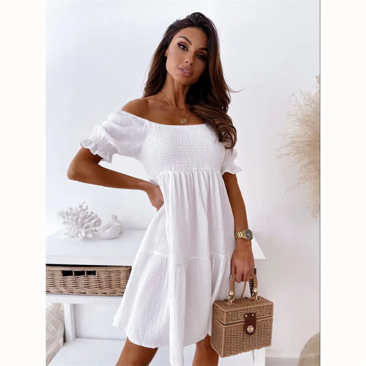 Sophisticated women's one-shoulder mini dress. Elegant summer fashion, a-line fit, great for casual or parties.