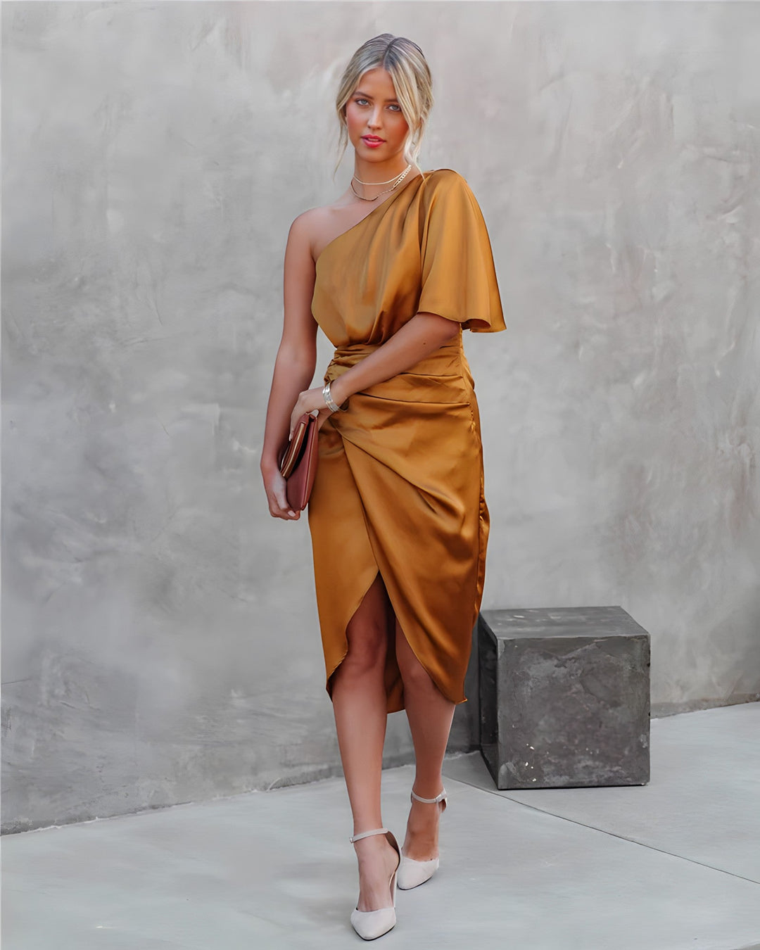 Detail of the one-shoulder neckline on a women's satin wrap midi dress, chic style