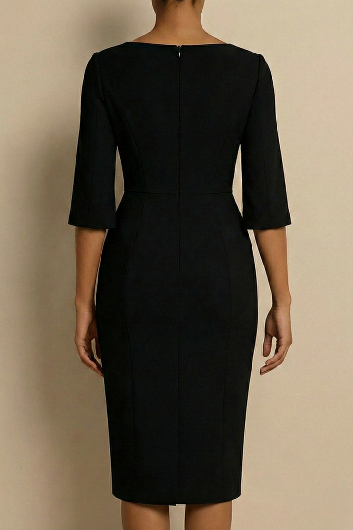 Sophisticated women's bodycon midi dress with pearl trim, an elegant choice for wedding guest or cocktail party.
