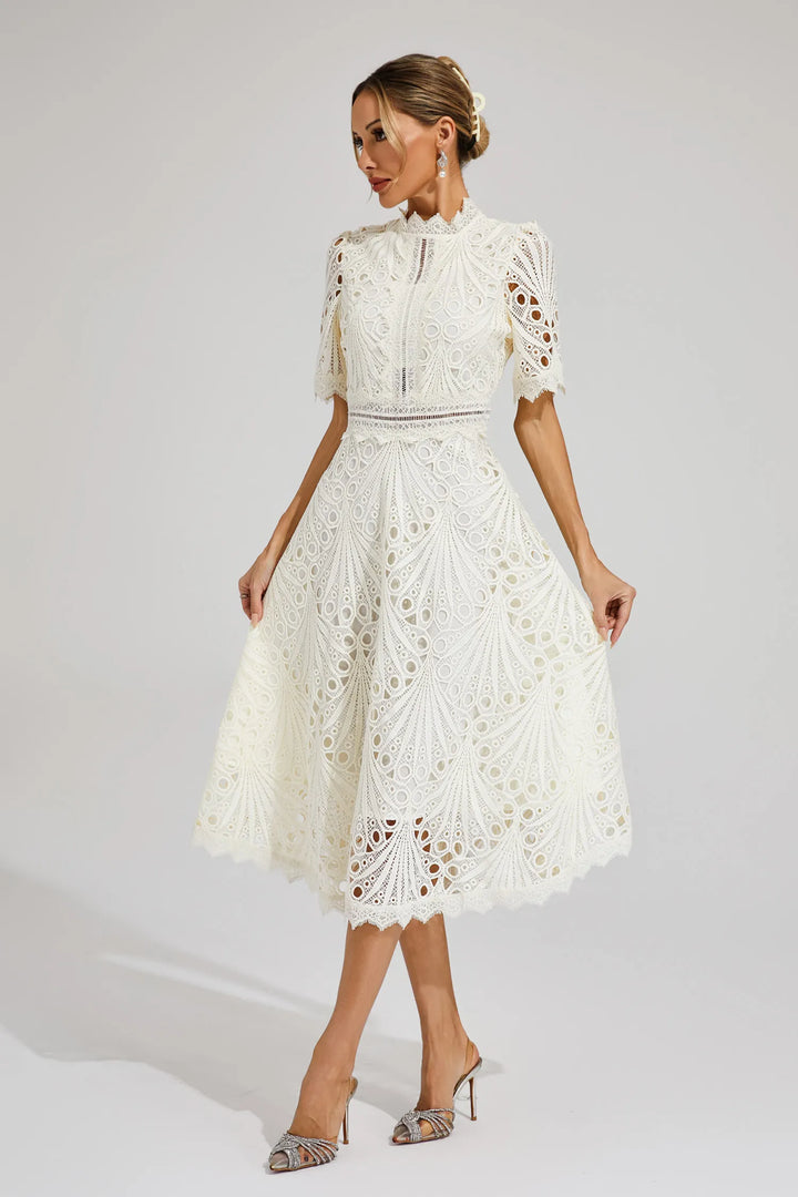 Elegant women's pink lace midi dress with delicate floral details, perfect for formal occasions.