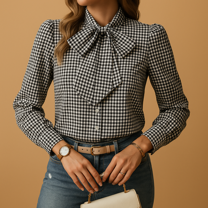 Fashionable women's plaid workwear blouse with a sophisticated bow detail. Comfortable long sleeve design.