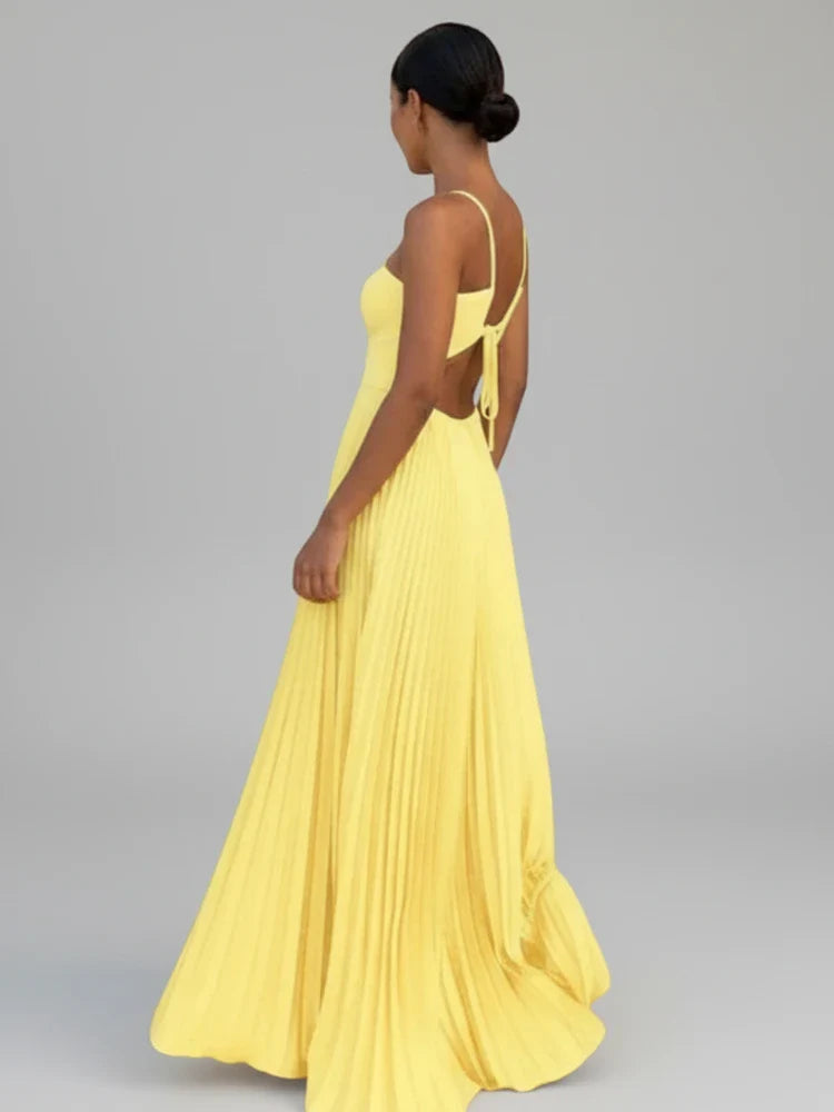Beautiful women's long pleated A-line maxi dress. Elegant and flowy, suitable for evening wear or summer parties.