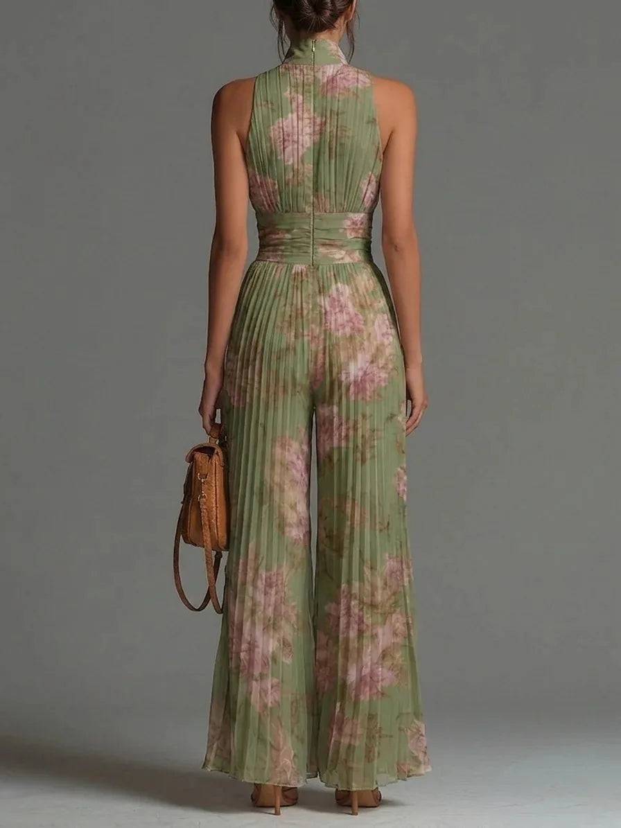 Chic floral print halter neck jumpsuit for women. Features a pleated bodice & wide leg, ideal for elegant summer fashion.
