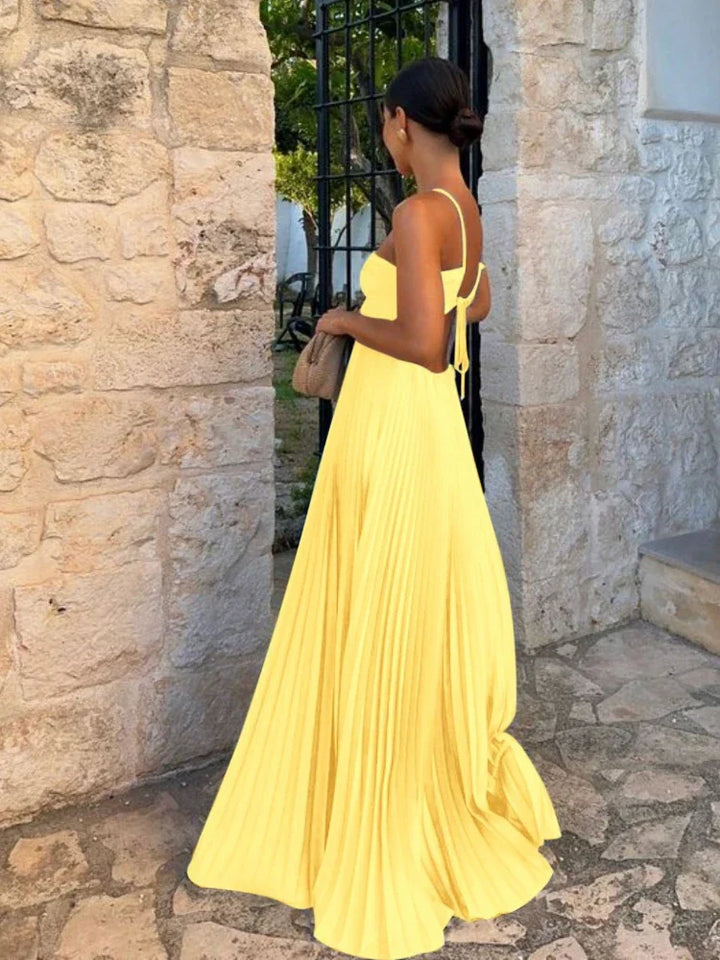 Stylish women's pleated maxi dress for wedding guests, formal events, and elegant party wear.