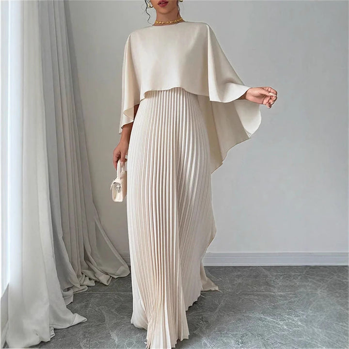 Elegant women's pleated maxi dress with a flowing cape overlay, perfect for formal occasions and evening wear.