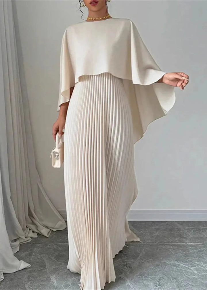 Elegant women's pleated maxi dress with a flowing cape overlay, perfect for evening events.