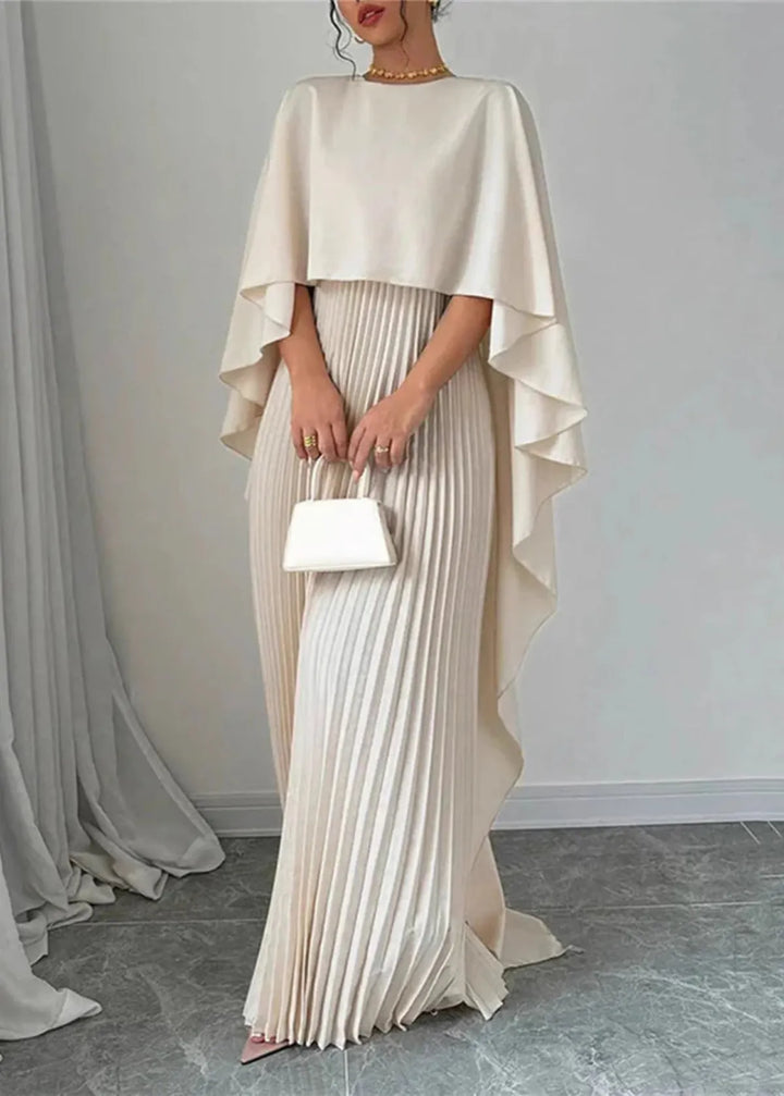Stylish women's evening gown with a unique pleated design and an elegant cape overlay detail.