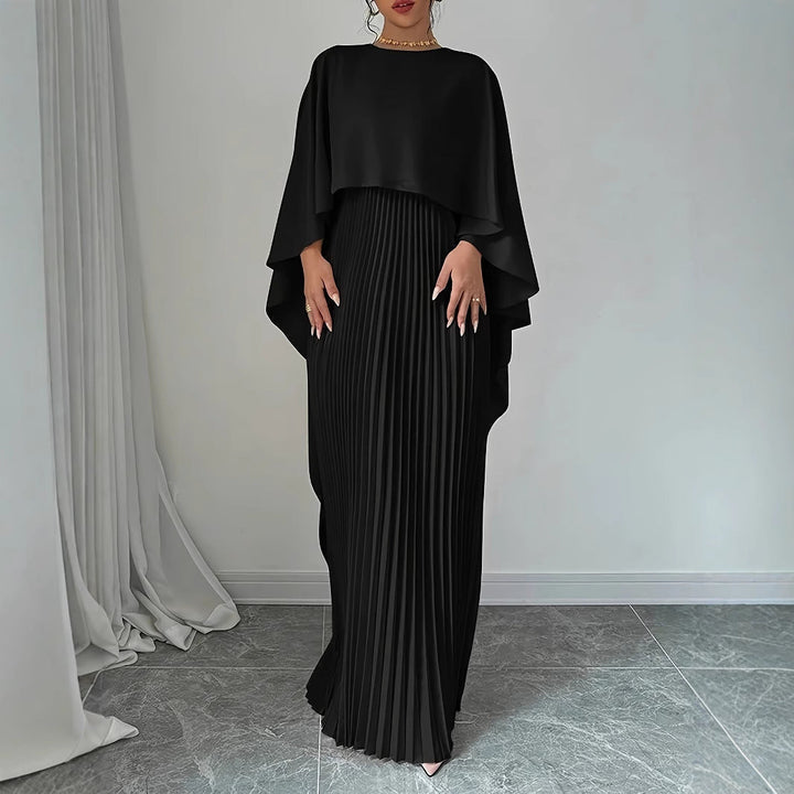 Long elegant women's maxi dress, beautifully pleated with a graceful cape overlay, suitable for special occasions.