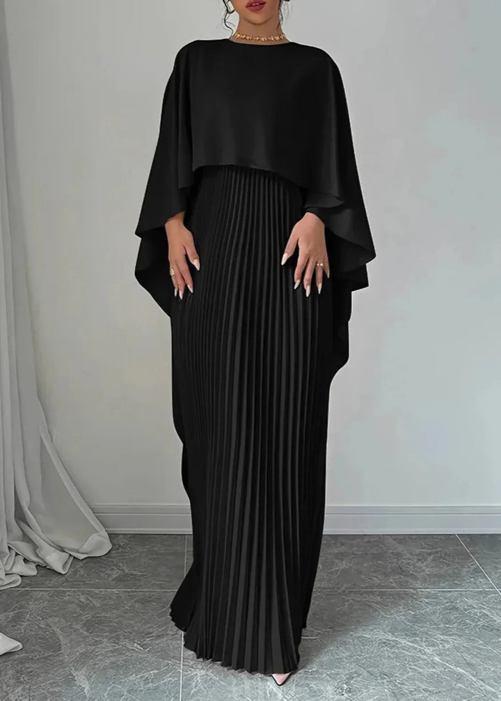 Long elegant women's dress, pleated and adorned with a graceful cape overlay, suitable for formal events.