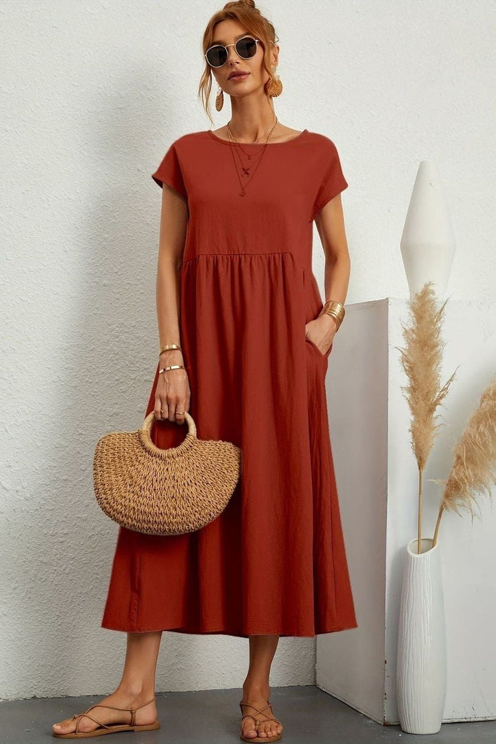 Modern women's midi dress, elegantly pleated. Great for versatile casual or formal events.