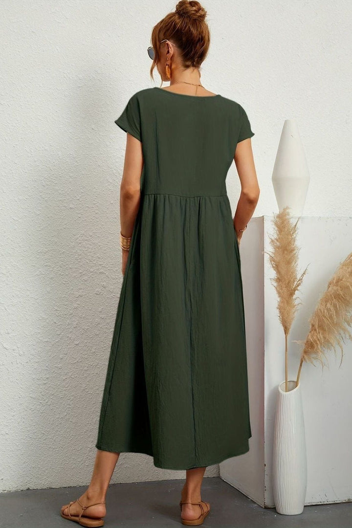 Spring-ready women's pleated midi dress. Elegant and versatile for effortless style.