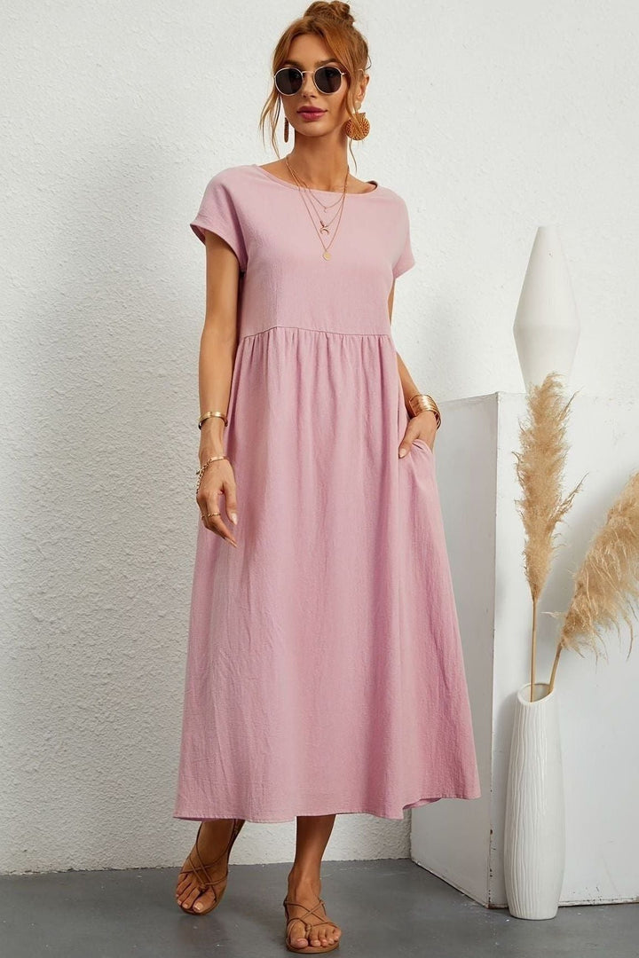 Summer fashion: elegant pleated midi dress for women. Versatile for casual or party wear.