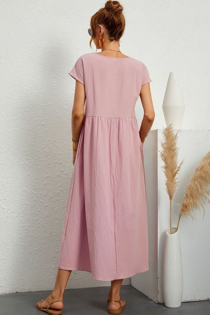 Women's elegant midi dress. Pleated for effortless style, suitable for various occasions.