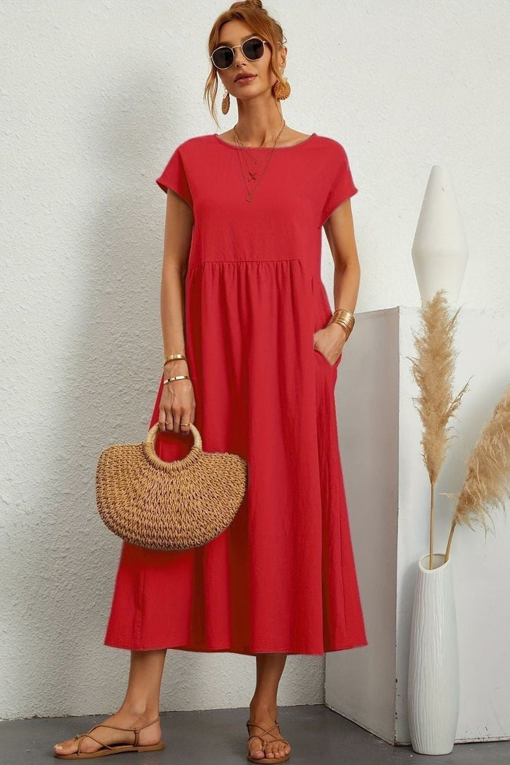 Flowy women's midi dress with elegant pleats. Effortless style for spring and summer.