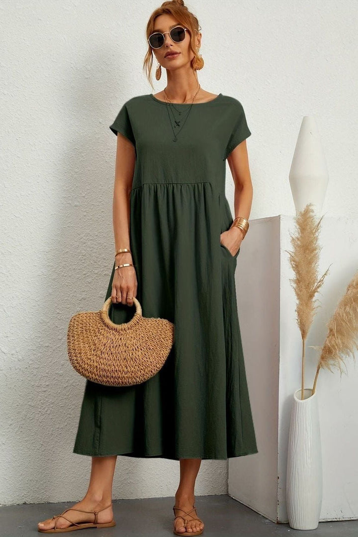 Women's fashion essential: elegant pleated midi dress, versatile for day or night.