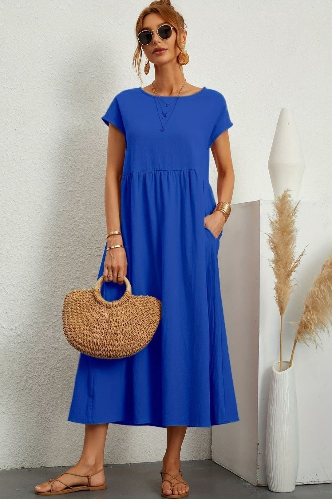Captivating women's pleated midi dress. Elegant, versatile, and perfect for parties.