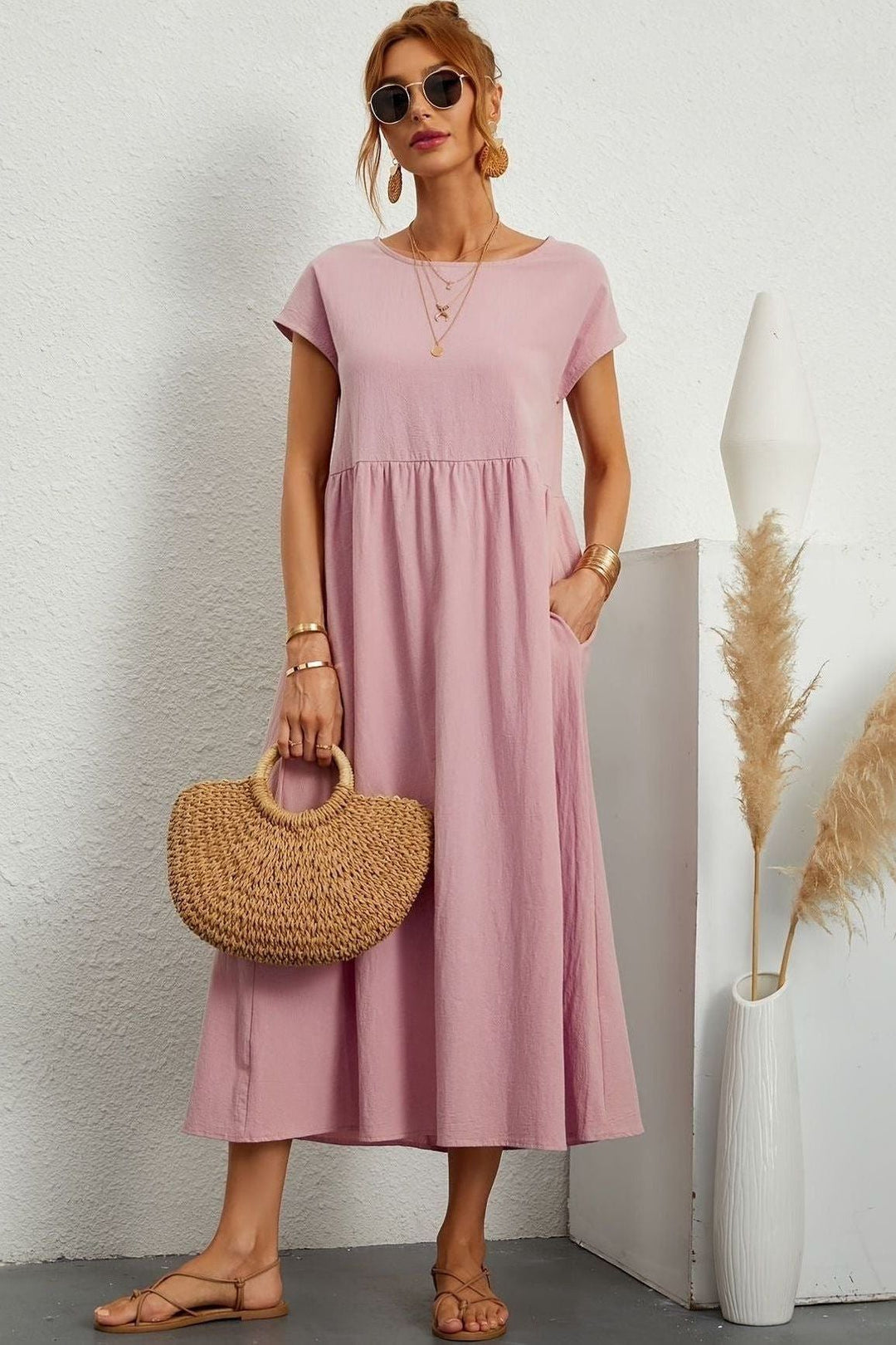Flattering women's midi dress with elegant pleats. Effortless style for special events.