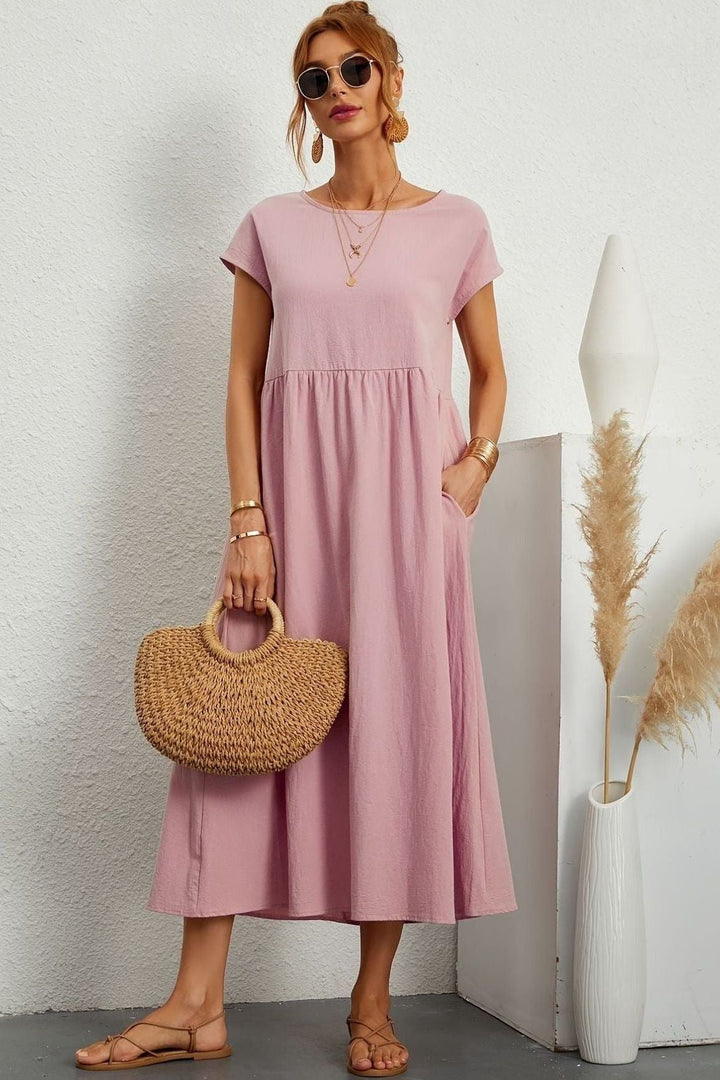 Flattering women's midi dress with elegant pleats. Effortless style for special events.