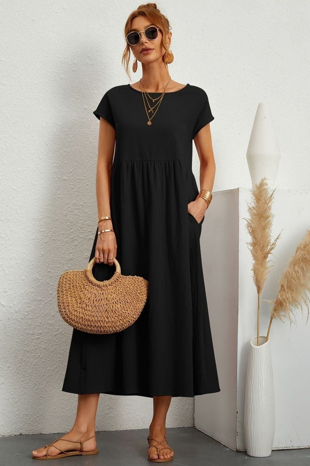 Easy-to-wear women's elegant pleated midi dress. Versatile for spring/summer events.