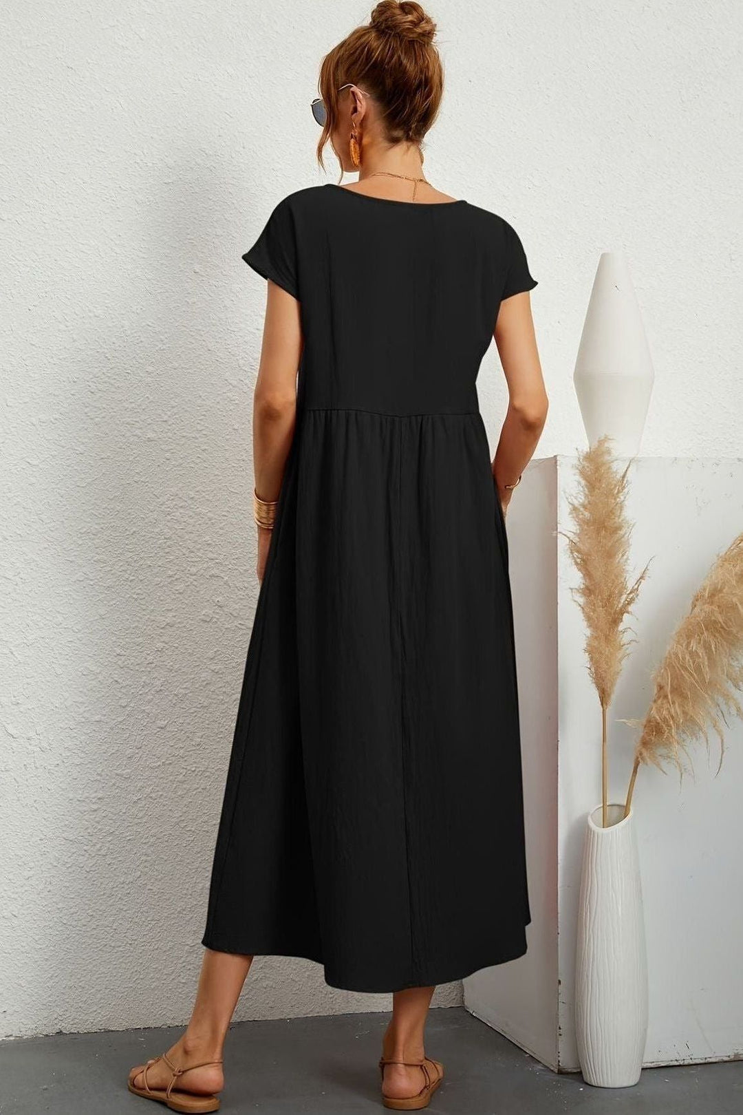 Fashionable women's elegant pleated midi dress. Perfect for a stylish party look.