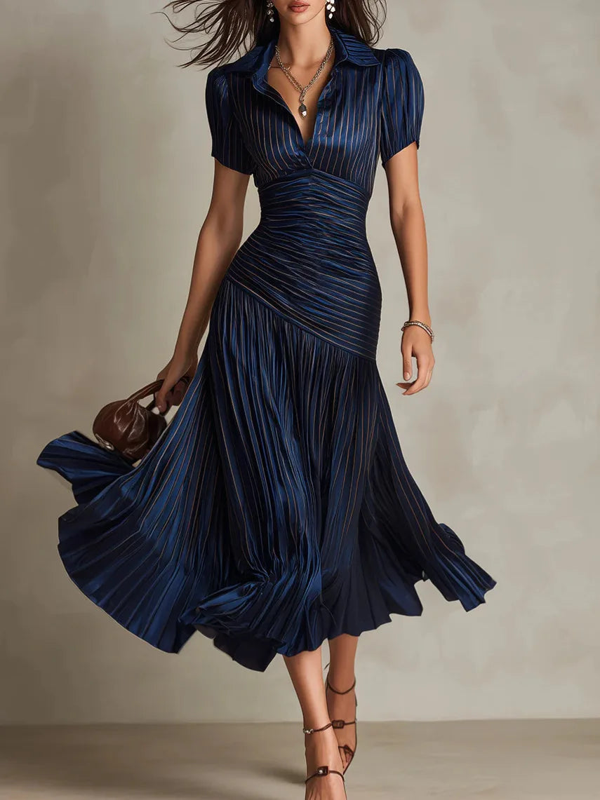 Elegant women's pleated midi dress with a flowing A-line silhouette, perfect for special occasions.