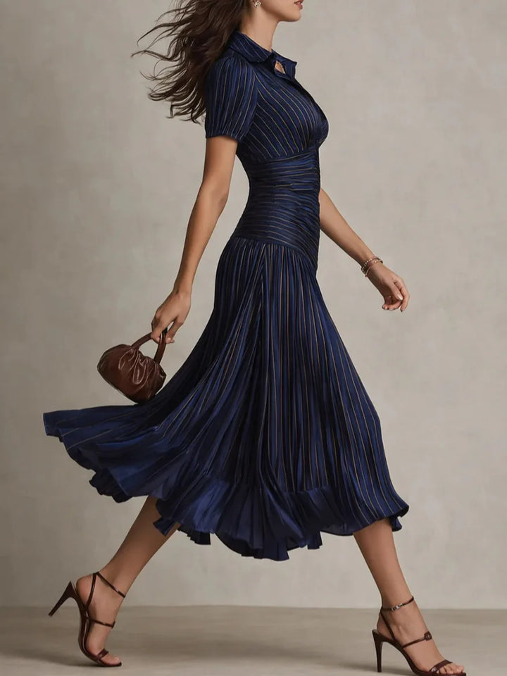 Chic navy blue women's pleated midi dress, A-line cut, ideal for elegant occasion wear fashion.