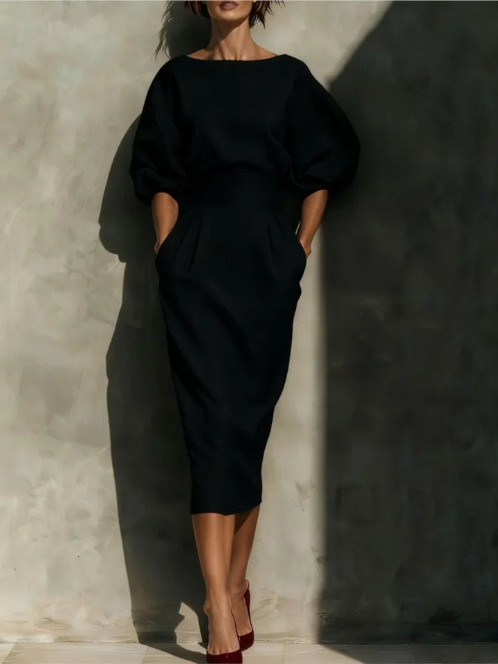 Classic women's midi dress with elegant pleats, stylish lantern sleeves, & a cinched waist. Suitable for formal & office occasions.