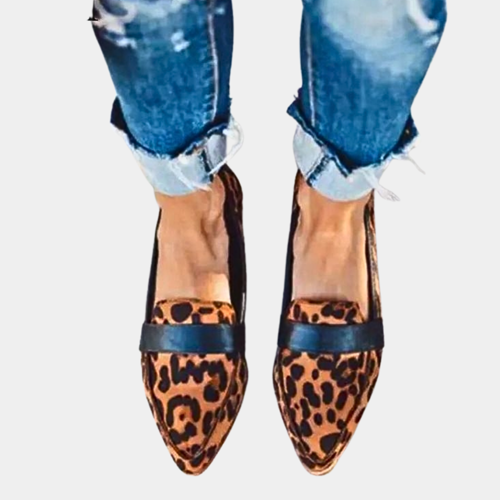 Classic black women's pointed-toe loafers, elegant slip-on flats for office or chic casual outfits.