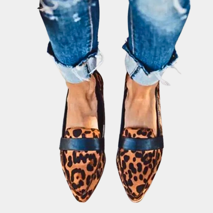 Classic black women's pointed-toe loafers, elegant slip-on flats for office or chic casual outfits.