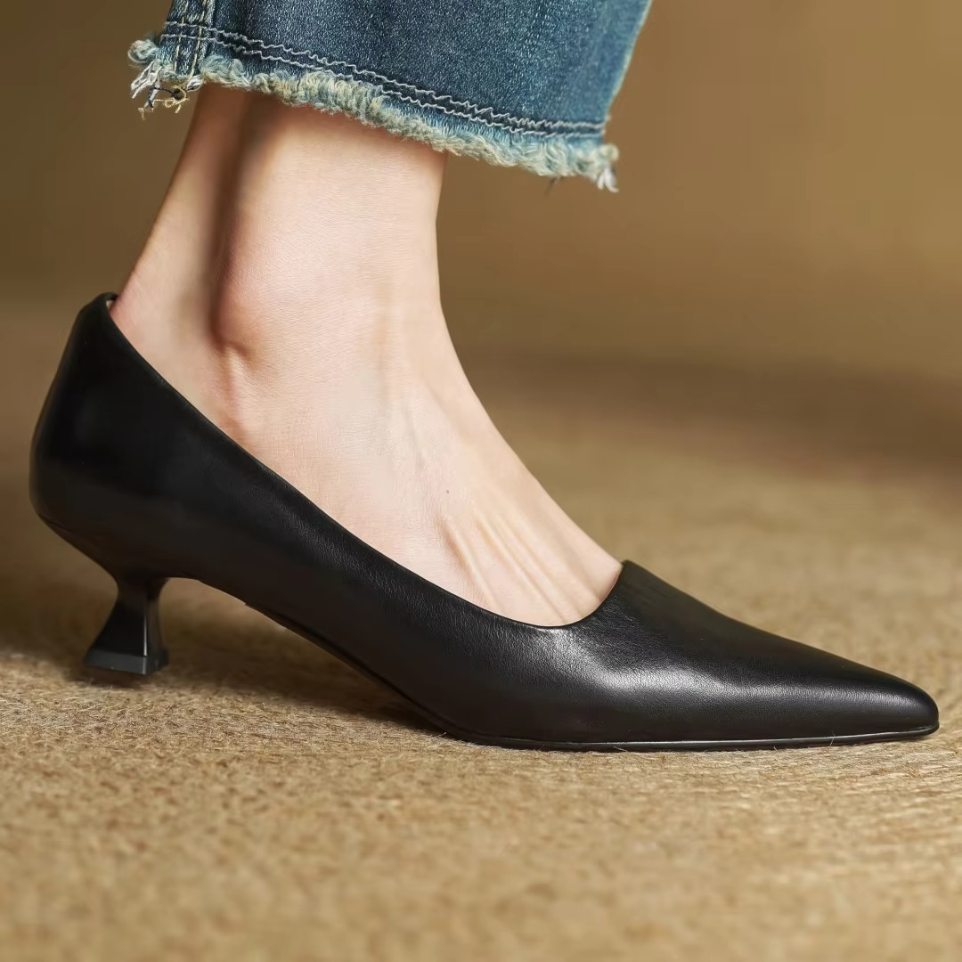 Sophisticated women's pointed-toe pump with a sleek thin heel, a comfortable and chic slip-on design.