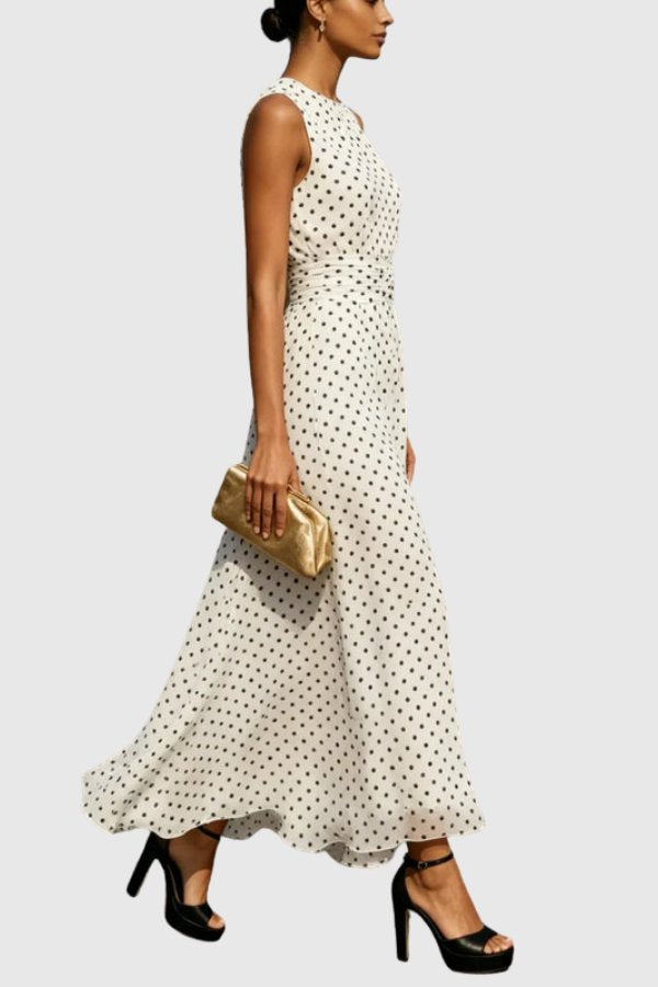 Women's formal polka dot maxi evening gown with a stylish ruffle hem. Ankle-length party dress.
