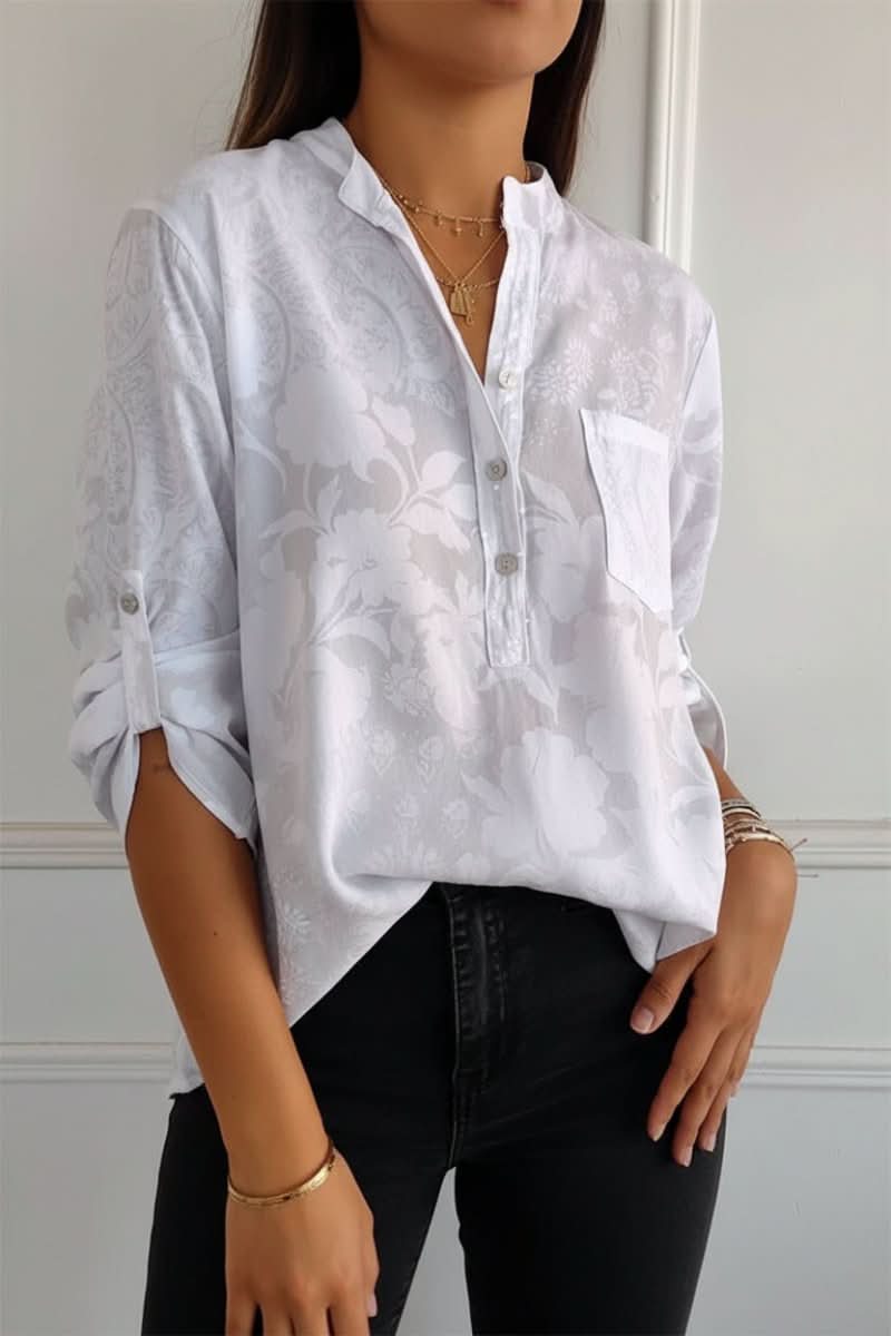 Stylish women's printed long sleeve top with a front pocket. Elegant button blouse for casual or professional wear.