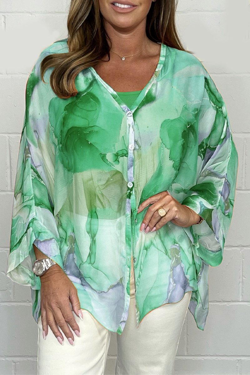 Versatile women's printed blouse with chic design. Loose fit, lightweight top for elegant summer fashion or spring style.