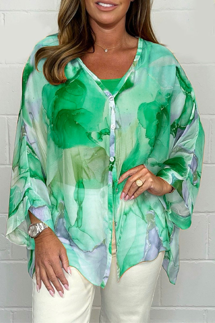 Versatile women's printed blouse with chic design. Loose fit, lightweight top for elegant summer fashion or spring style.