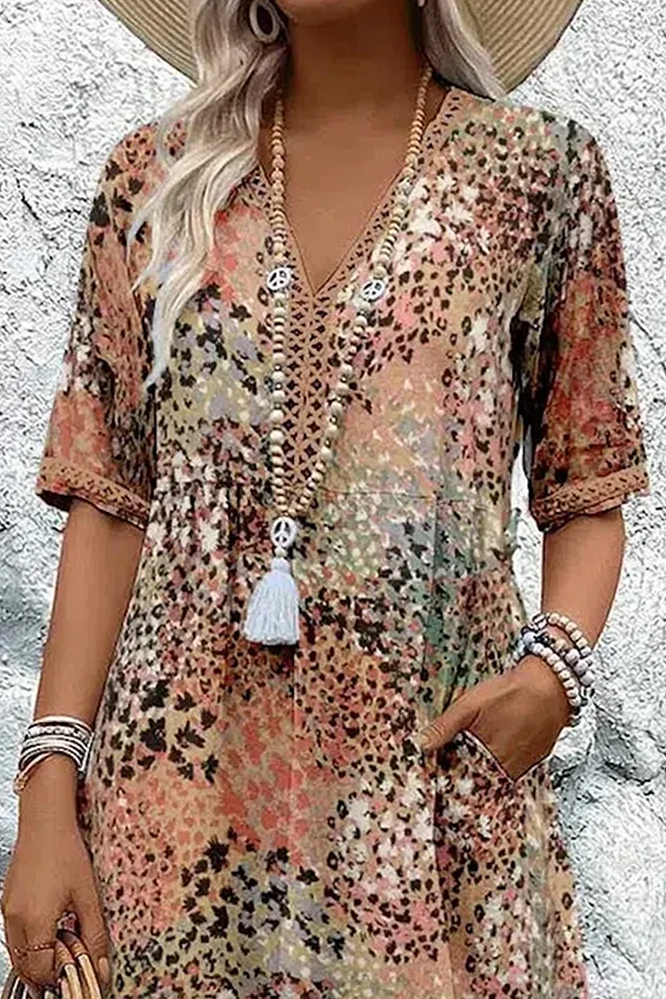 Stylish women's elegant midi dress featuring a unique print, perfect for flattering spring/summer style.