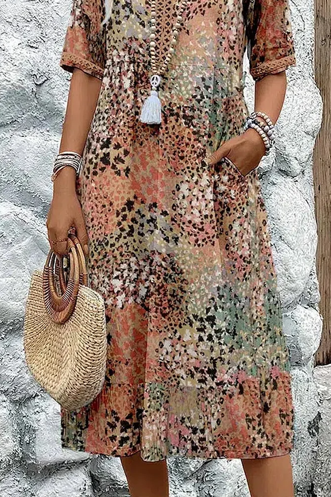 Full view of women's comfortable printed midi dress, elegant & flattering for any spring/summer wardrobe.