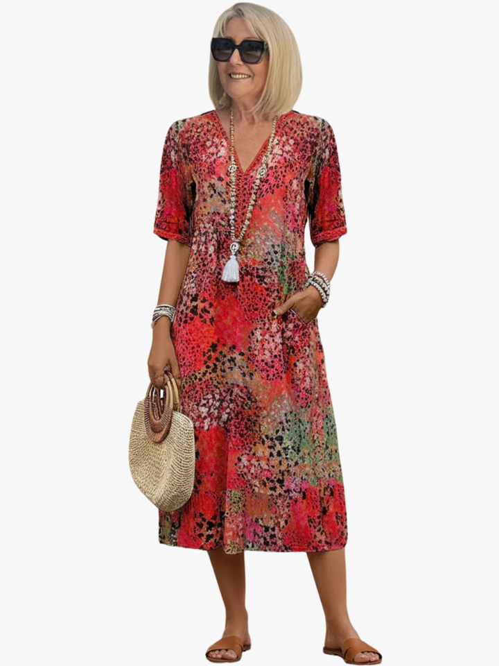 Elegant women's printed midi dress with V-neck, A-line cut, perfect for summer casual wear.