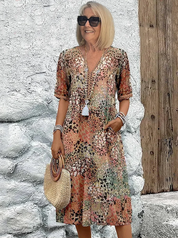 Elegant printed women's midi dress with V-neck, A-line silhouette, perfect for versatile summer styling.