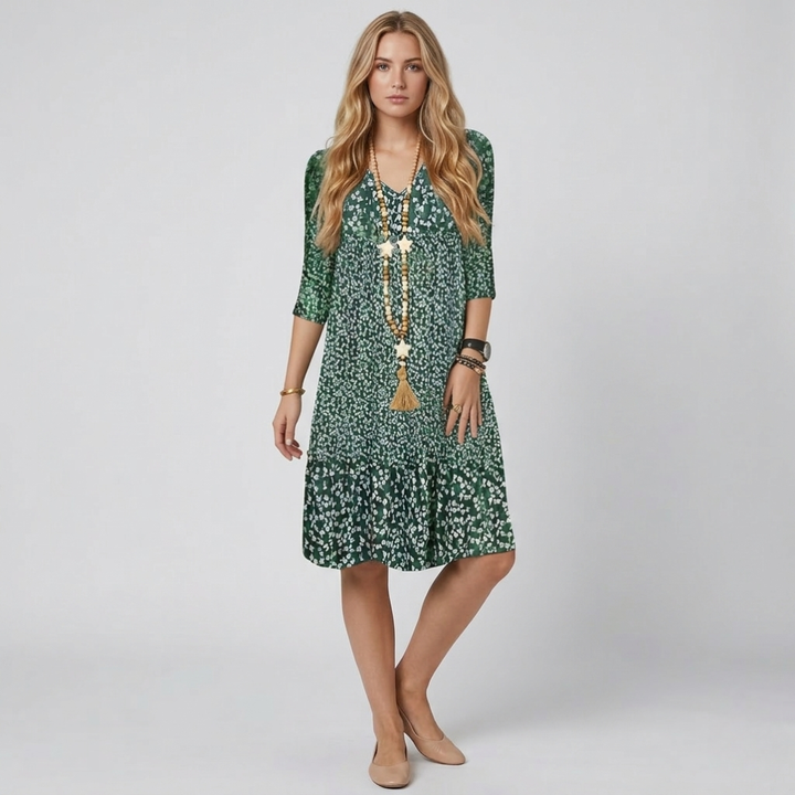 Elegant women's printed midi dress with v-neck and A-line silhouette, perfect for spring/summer casual style.