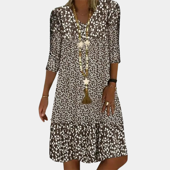 Stylish A-line women's midi dress featuring a vibrant print & flattering v-neck, great for any occasion.
