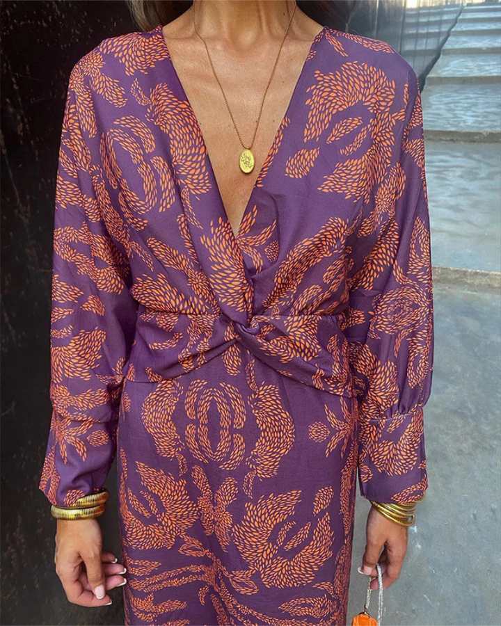 Stunning printed maxi dress for women, featuring a V-neck and long sleeves, suitable for parties.