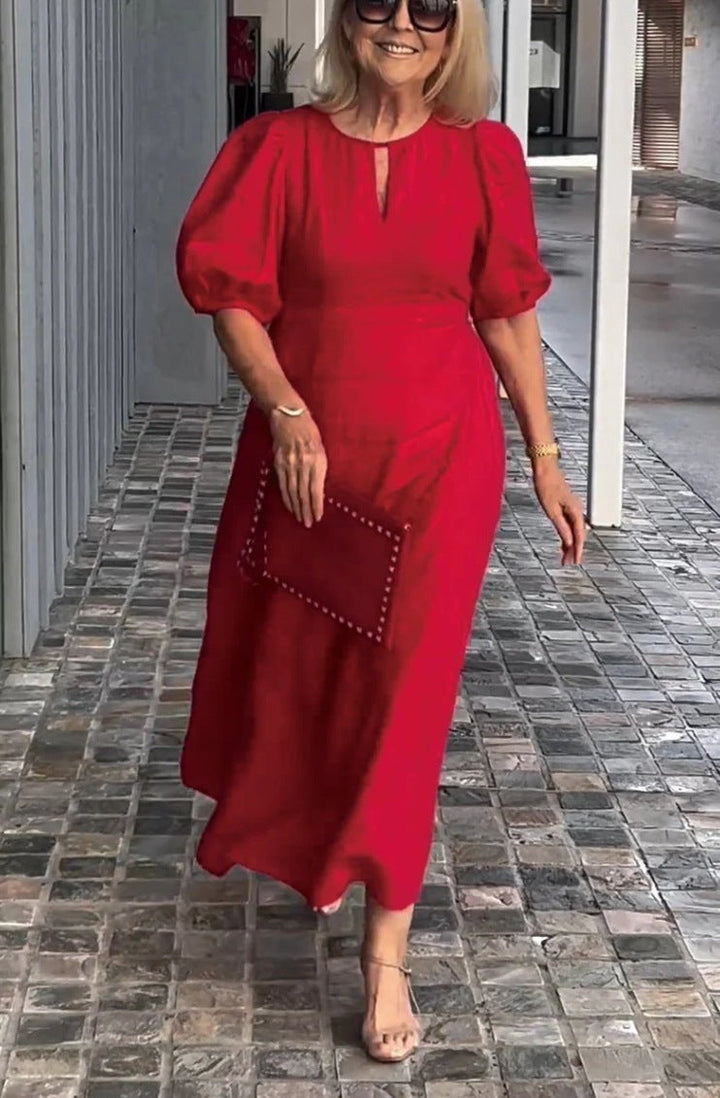 Versatile women's midi dress with elegant puff sleeves, perfect for formal or casual occasions.