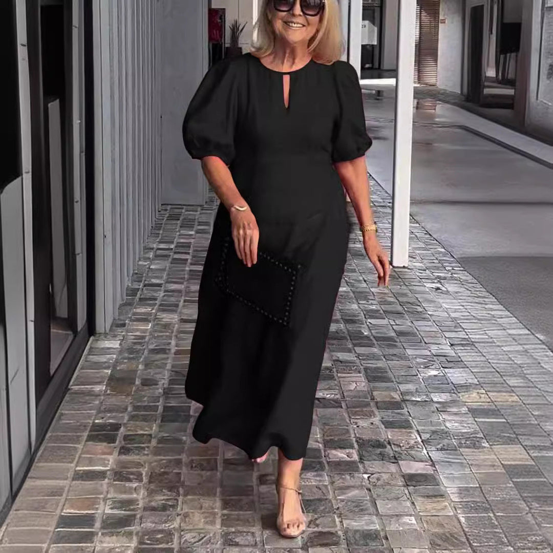 Chic women's puff-sleeve midi dress, a stylish and feminine apparel choice for spring/summer.