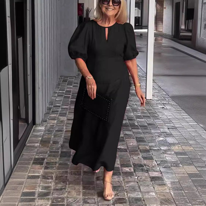 Chic women's puff-sleeve midi dress, a stylish and feminine apparel choice for spring/summer.