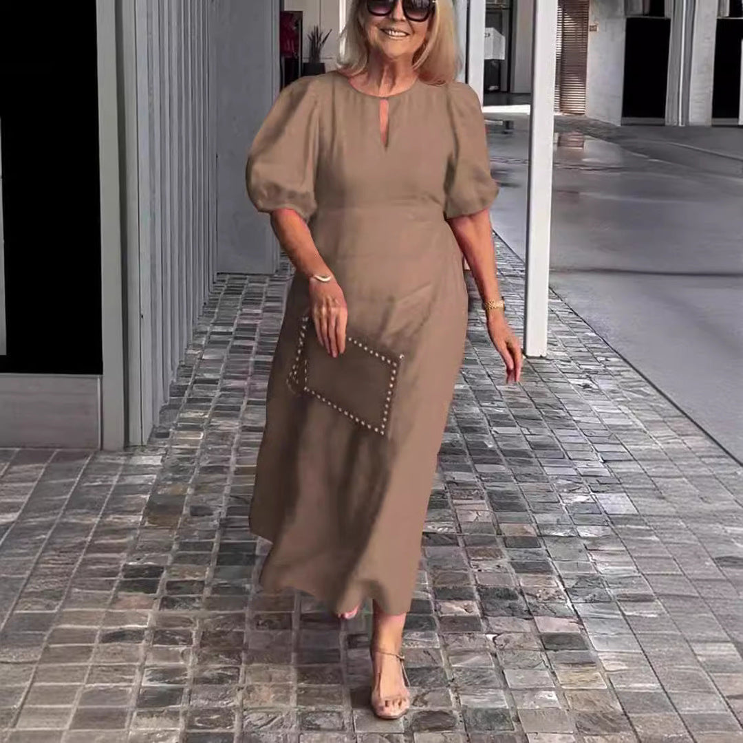 Feminine elegant puff-sleeve midi dress for women, perfect for a chic and flattering look.