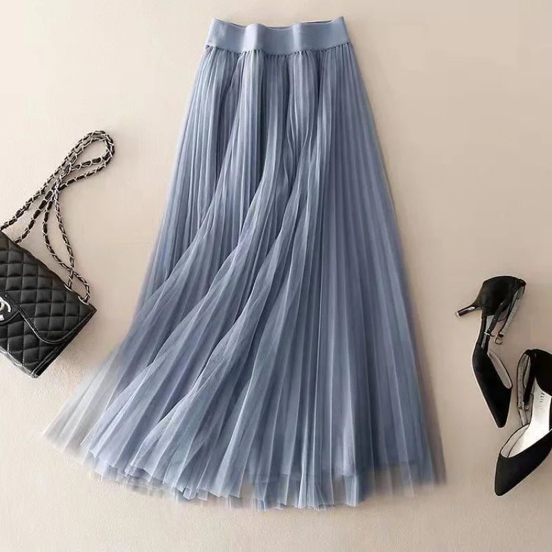 Women's elegant pleated A-line flowy midi skirt, high-waist design. Perfect for casual summer fashion.
