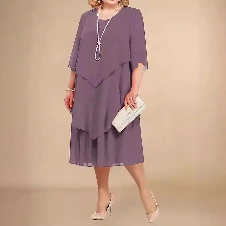 Purple women's A-line midi dress. Comfortable 3/4 sleeve, round neck. Effortless style, ideal for elegant occasion wear.