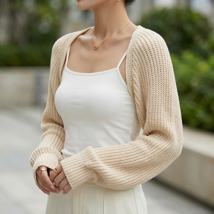 Versatile women's ribbed long sleeve shrug cardigan. Cropped design, ideal for elegant layering or casual fashion.