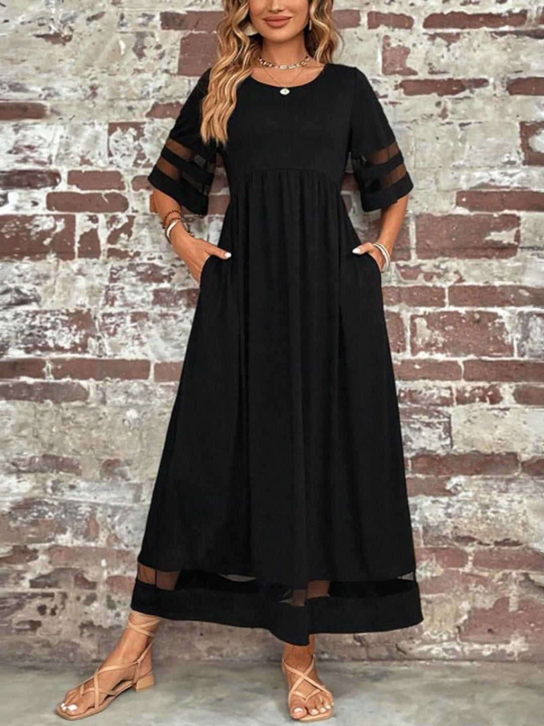 Dark green women's elegant round neck maxi dress. Flowing short sleeve style with a gathered waist, ideal for any occasion.