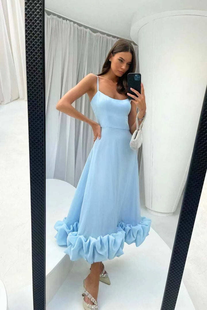 Long elegant women's party dress, features ruffle hem, spaghetti straps, perfect for any special occasion.